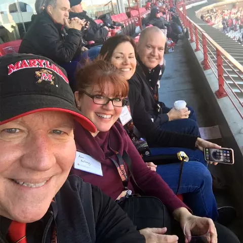 Dr. Ken and Ann Baron with friends Jean and Paul Richards at a Maryland football game