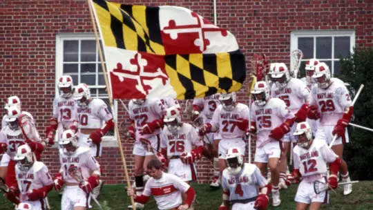 Maryland men's lacrosse running out with the flag in 1979