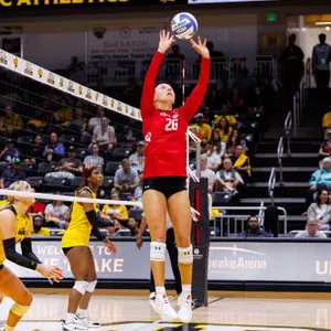 Lilly Wagner setting a ball against UMBC