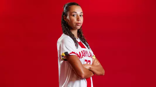 Taryn Raibon Posed Red Background