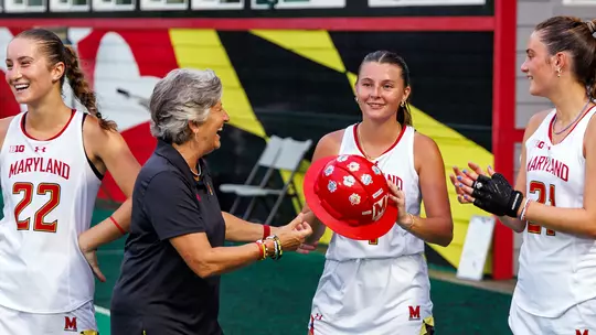 Missy Mehard presenting The Hard Hat to Maci Bradford