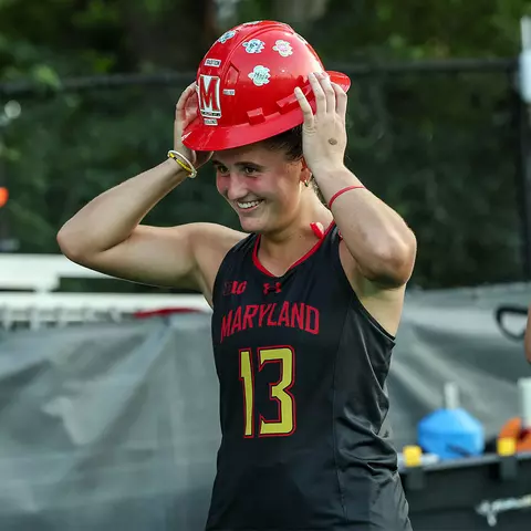 Jordyn Hollamon wearing The Hard Hat after a Maryland field hockey victory.
