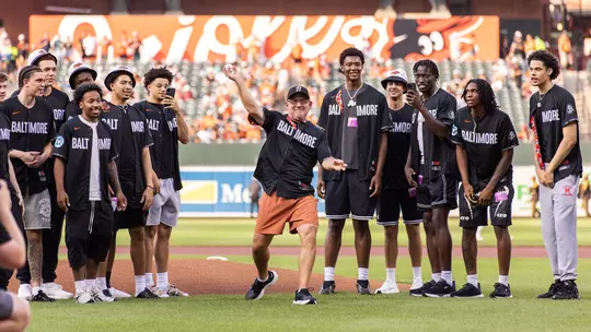 Buzz Williams throwing out the first pitch at a Baltimore Orioles game