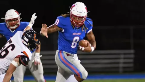 Cam Rice playing high school football