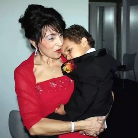 Lori Rice holding a young Cam Rice