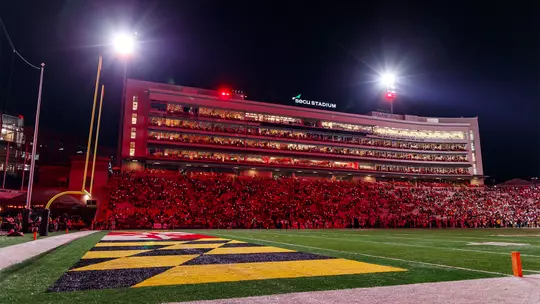 SECU Stadium at night with the lights on