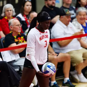 Ajack Malual gets ready to serve against Rutgers