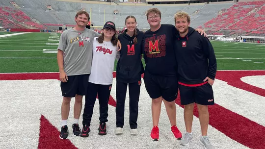 Brook Kline with fellow football student managers