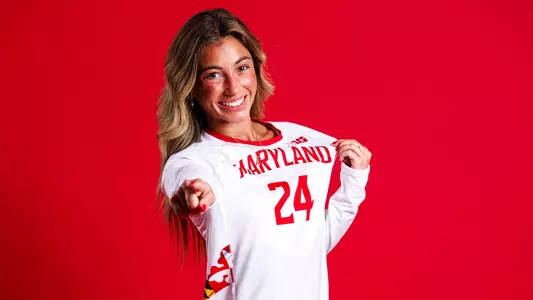 Ally Williams posed red backdrop