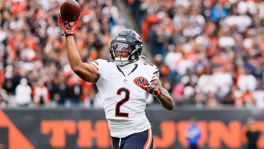 DJ Moore throws a pass for the bears