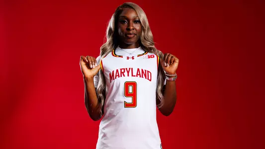 Isi Ozzy-Momodu posed red background