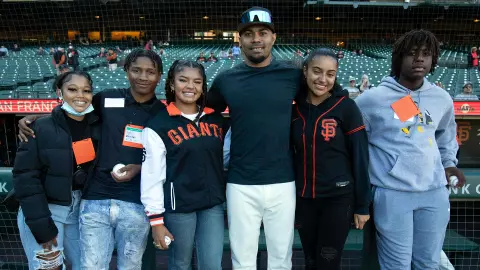 LaMonte Wade Jr. with the Willie Mays Scholars