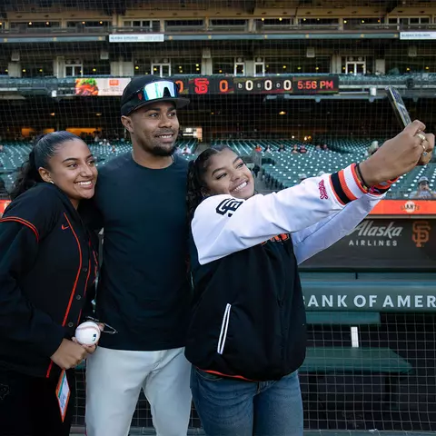 LaMonte Wade Jr. with the Willie Mays Scholars