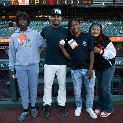 LaMonte Wade Jr. with the Willie Mays Scholars