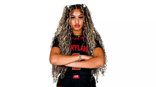 Kaylene Smikle black uniform white background