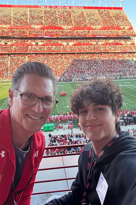 Mark Ciardi with one of his sons at a Maryland football game at SECU Stadium
