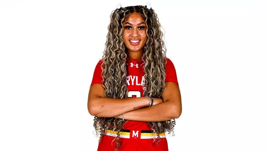 Kaylene Smikle red uniform white background