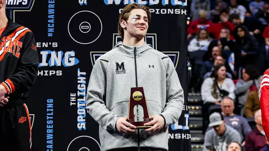 Jaxon Smith receives his All-America trophy at the 2025 NCAA Wrestling Championships
