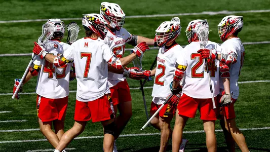 Men's Lacrosse celebrates after scoring a goal against Michigan