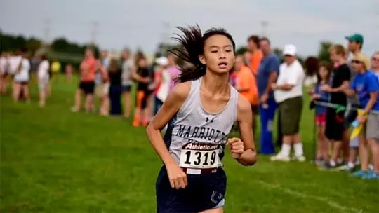 Kallista Liu running cross country as a freshman in high school