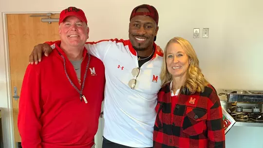 Robbye Fox and her husband with Vernon Davis