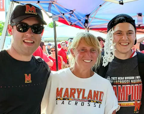 Logan McNaney with his brother and mom after the 2022 NCAA Championship