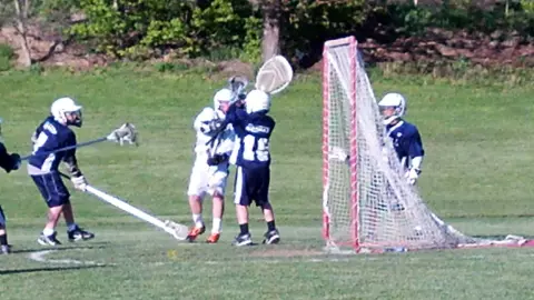 Logan McNaney playing one of his first youth lacrosse games as a goalie