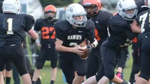 Logan McNaney playing football in his youth