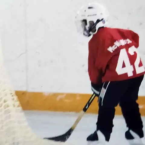 Logan McNaney playing hockey in his youth