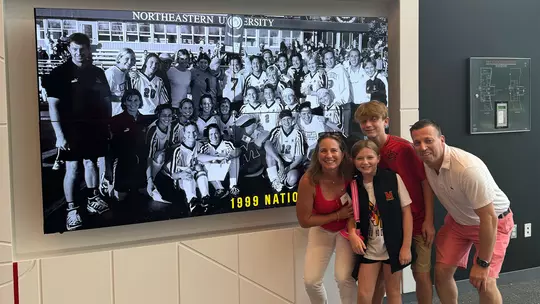 Megan Kelly with her family at the Champions wall at the Field Hockey & Lacrosse Complex
