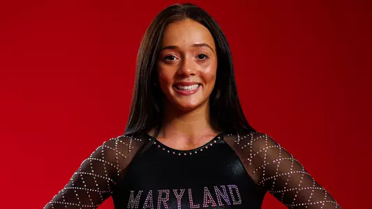 Chelsey Dennis Posed Red Background