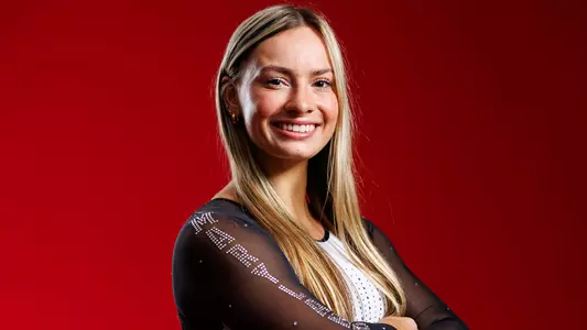 Megan Bingham Posed Red Background
