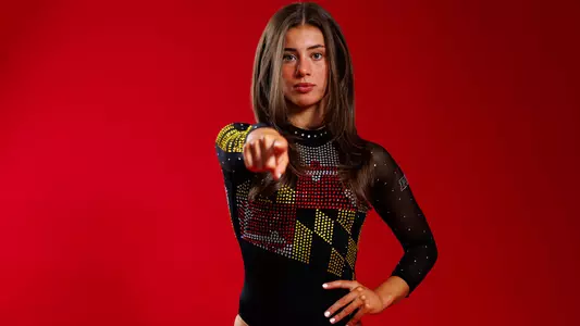 Maddie Komoroski Posed Red Background