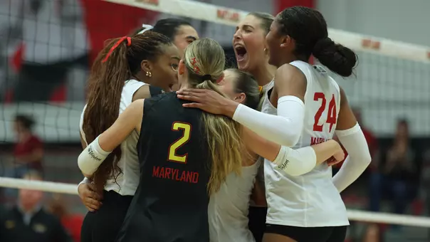 Maryland celebrates a kill against Iowa