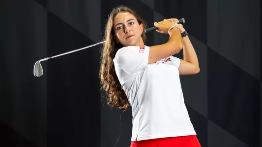 Noa Zocco swings a club posed