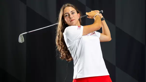 Noa Zocco swings a club posed