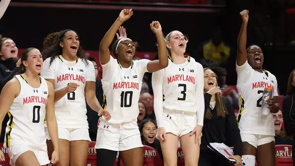 Maryland's bench celebrates a basket against VT