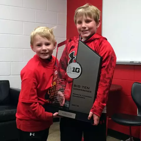 Brody and Riley Reese with the Big Ten Championship trophy