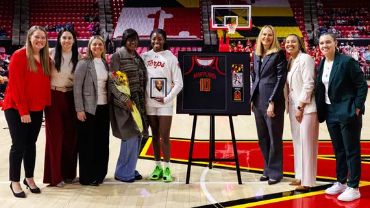 Mir McLean and her mom, family and Maryland coaching staff at Mir's senior day celebration