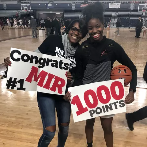 Mir McLean and her mom celebrating scoring 1000 career points in high school