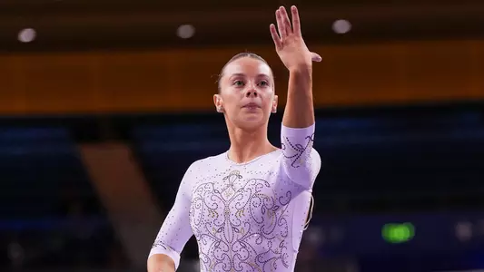 Josephine Kogler Posing on Beam at UCLA