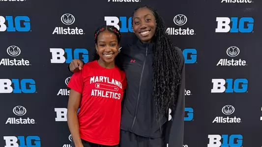 Maya Valmon and Tolu Akinduro pose after competing at the Big Ten Championships