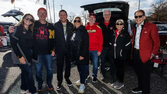 The Green family at a Maryland football tailgate with Barry P. Gossett Director of Athletics Jim Smith
