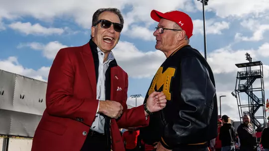 Barry P. Gossett Director of Athletics Jim Smith and Martin Green share a laugh at a Maryland football tailgate