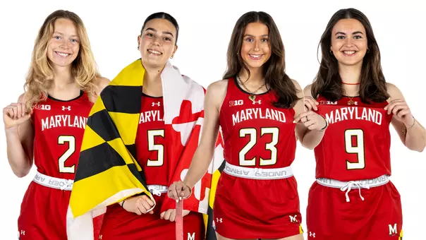 Field Hockey posed action shot of four new additions