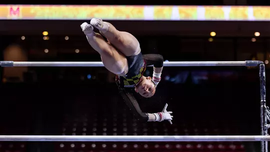 Gianna Ruffing performing a bars routine