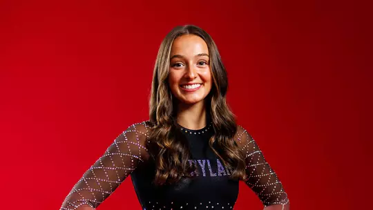 Studio photo of Gianna Ruffing on a red background
