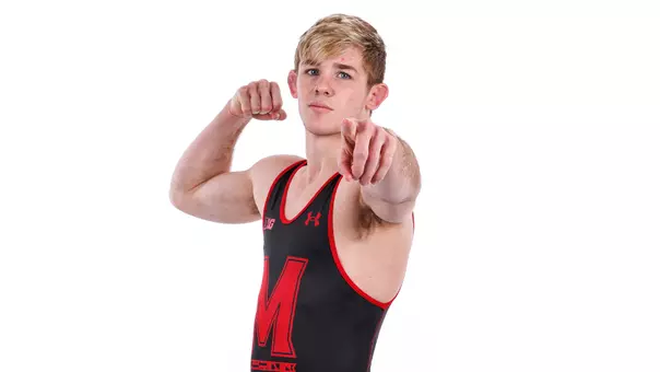 Carter Young poses white backdrop