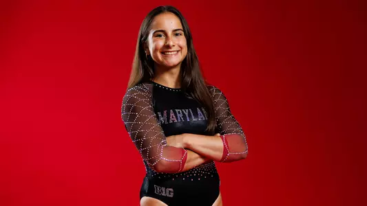Emily Defrees Posed Red Background