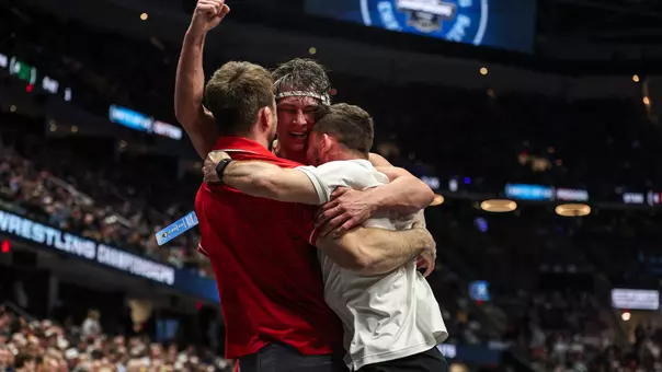 NCAA Championships Branson John Embraces his coaches after becoming an all american